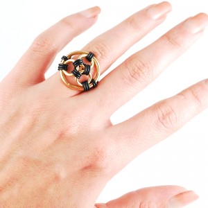 black rubber and gold color rubbermaille finger ring on hand