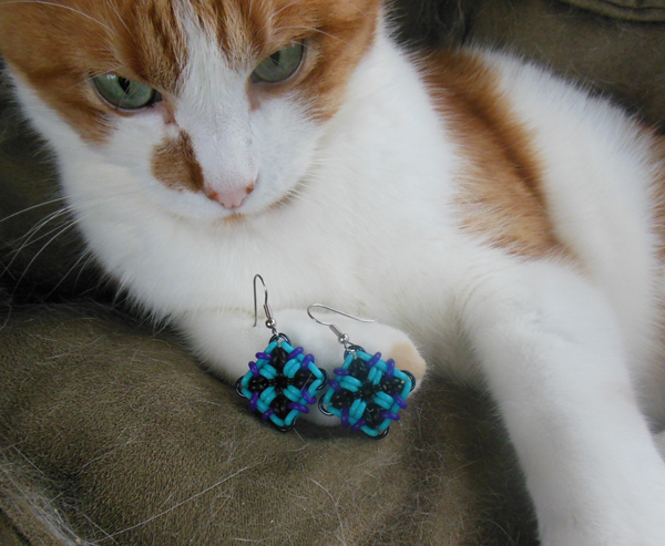 cat with biomechanical earrings