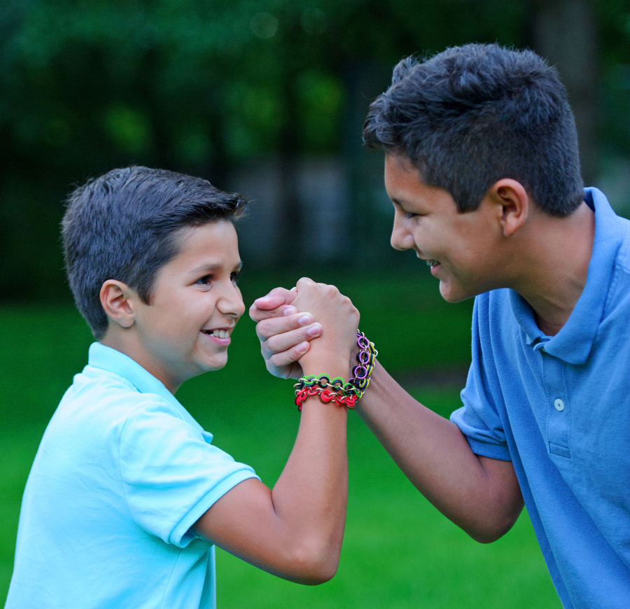 two boys wearing male friendship bracelets from Linkt Craft Kits Maille Bonding