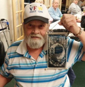 veteran holding POW MIA art made of chainmaille