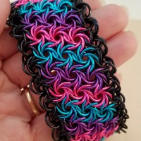 pink, purple, turquoise moorish rose cuff with black edging