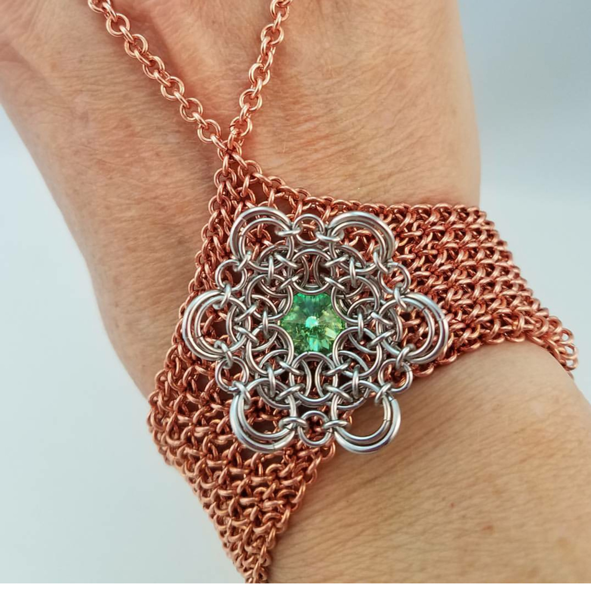 copper chainmaille handflower with aluminum and green stone decoration