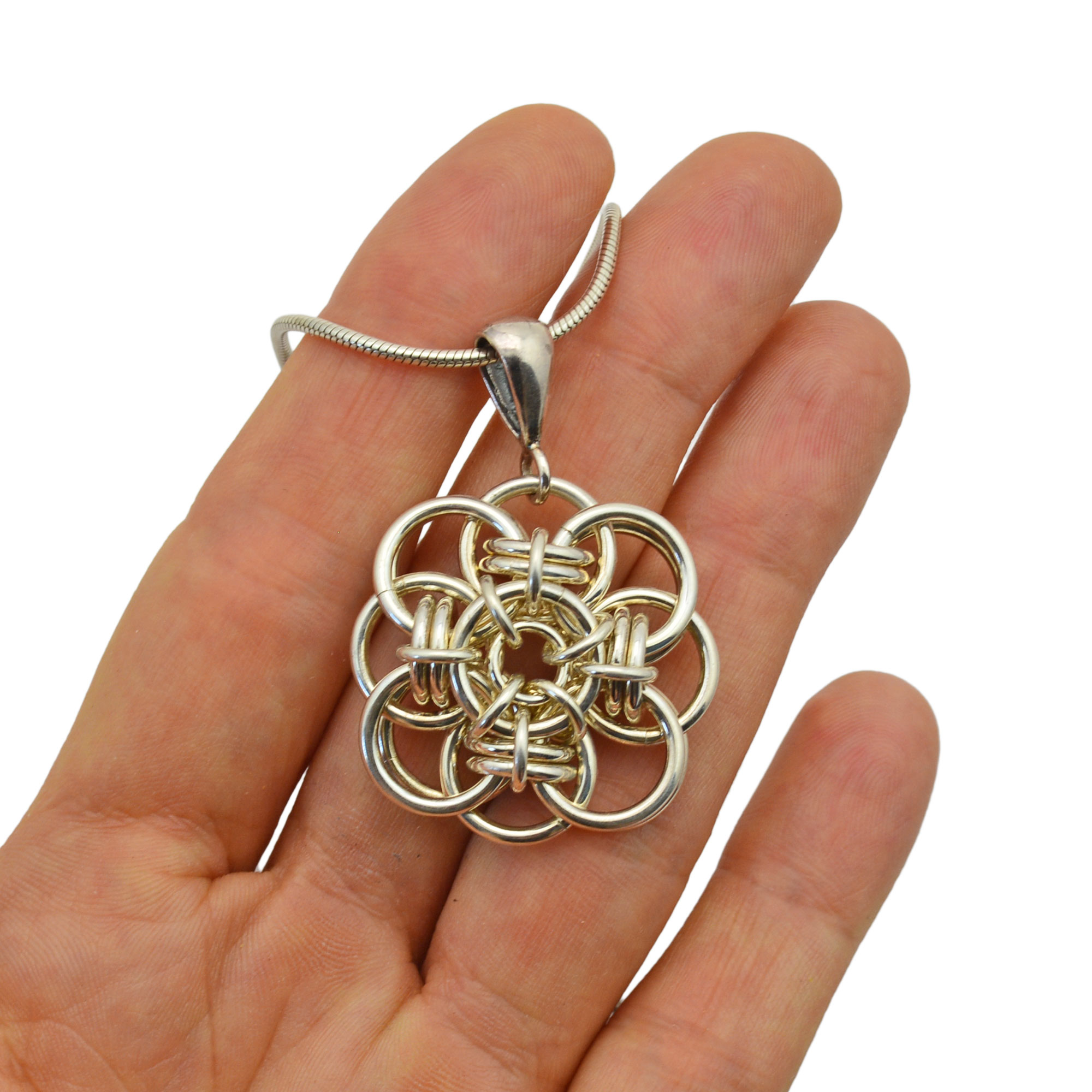 quantum rose sterling silver pendant in palm