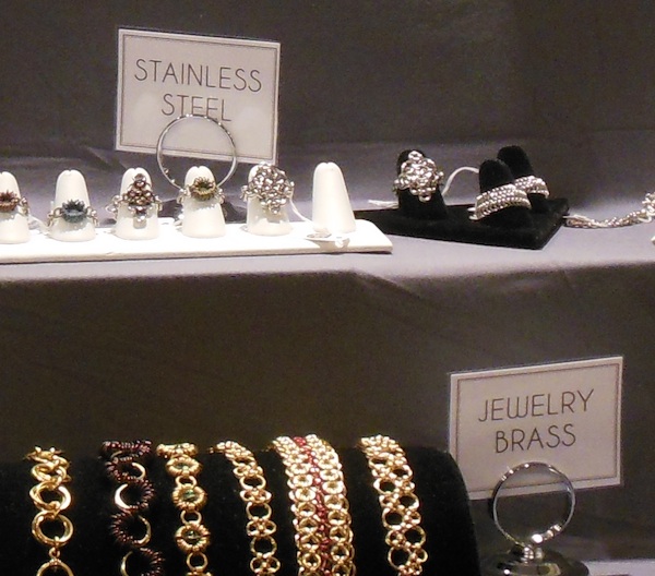 jewelry signs indicating stainless steel and brass materials