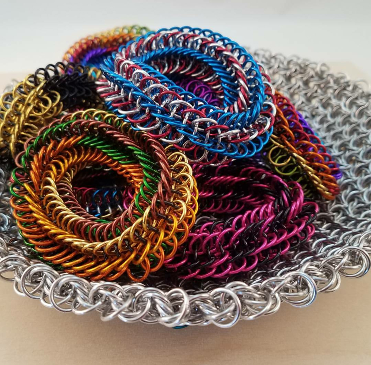 colorful Infinity Rose Fidget toy and bracelets in chainmaille moorish rose basket