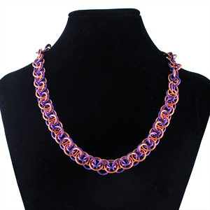 wobble weave in copper and purple jump rings on black neck form
